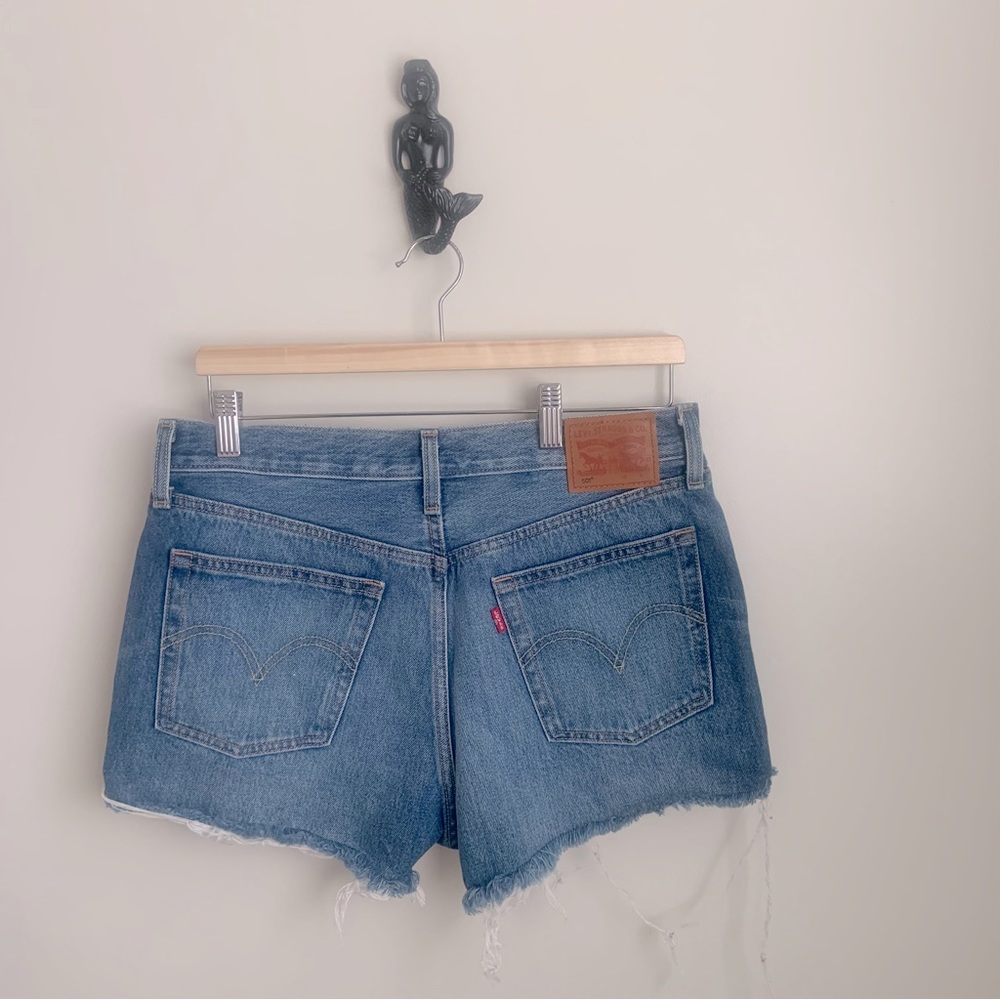 Levi’s 501, cut off shorts medium blue denim in size 29